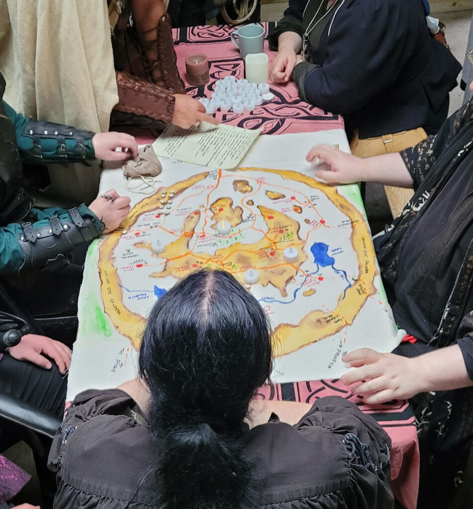 Photograph of players poring over a map