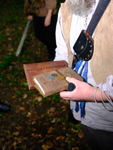 Closeup photo of a player carrying magic books
